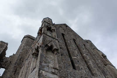 Low angle view of old building against sky