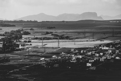 Aerial view of agricultural field against sky