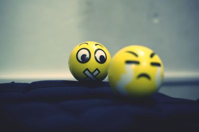 Close-up of yellow art on table