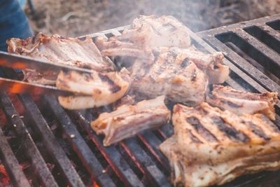 High angle view of meat on barbecue grill