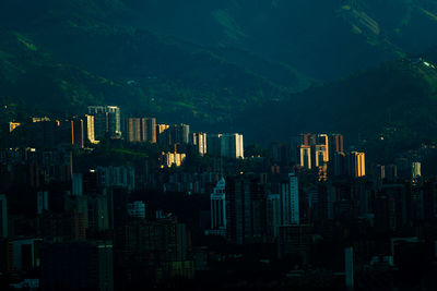 Illuminated buildings in city at night