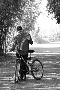 Man riding bicycle on tree