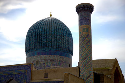 Low angle view of mosque against sky