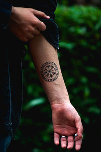 Close-up of man hand holding plant