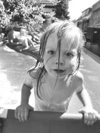 Portrait of a girl looking at swimming pool