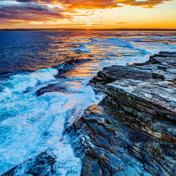 Scenic view of sea against sky during sunset