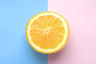 Close-up of orange slice against white background