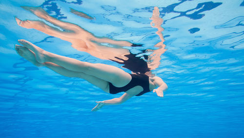 Woman swimming in sea
