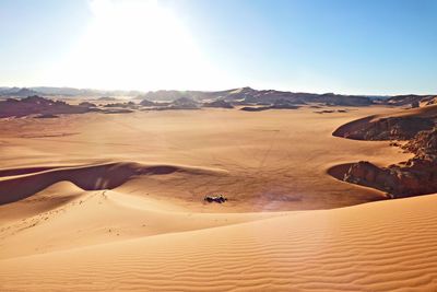 Scenic view of desert against clear sky