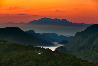 Scenic view of mountains against sky during sunset