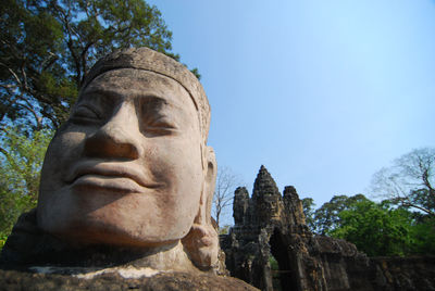 Low angle view of statue against sky
