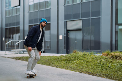 Full length of man walking on street