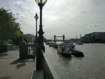 Boats in river with buildings in background