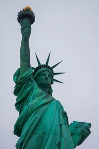 Low angle view of statue against sky