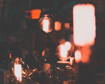 Close-up of illuminated light candles on table at restaurant