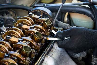 Close-up of man working in car