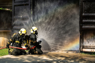 People in water against built structure