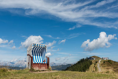 Built structure on field against sky