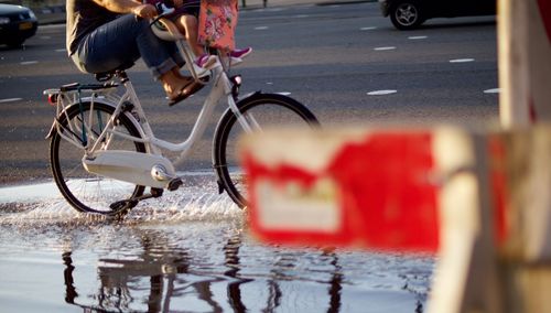 Man riding bicycle on road