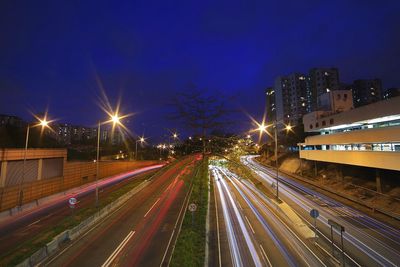 High angle view of light trails on road at night