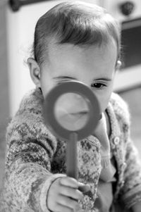 Close-up portrait of cute boy playing
