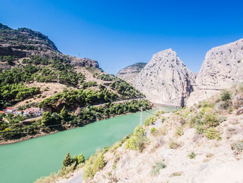 Scenic view of mountains against blue sky