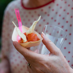 Midsection of person holding food