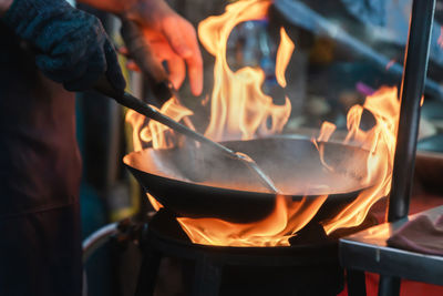 Midsection of man preparing food