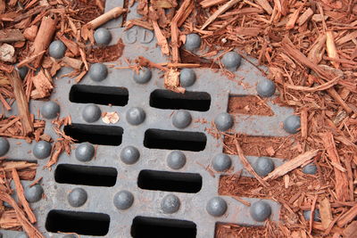 High angle view of rusty metal on field