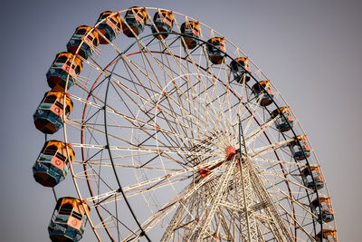 Closeup of multi-coloured giant wheel during dussehra mela in delhi, india. bottom view giant wheel