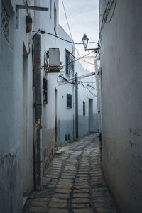 Alley amidst buildings in city