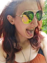 Portrait of young woman wearing sunglasses