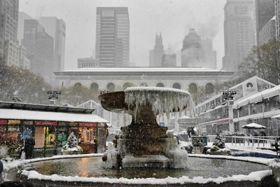 Fountain in city during winter