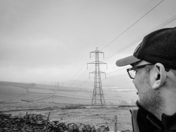 Portrait of man with sunglasses against sky