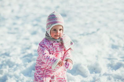 Portrait of cute girl in snow