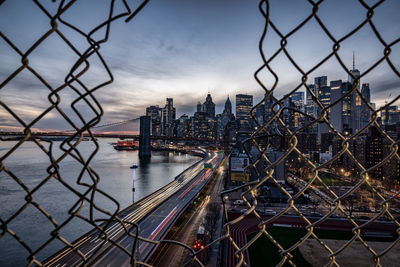 Brooklyn bridge over river in new york city at blue hour