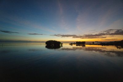 Scenic view of sea against sky at sunset