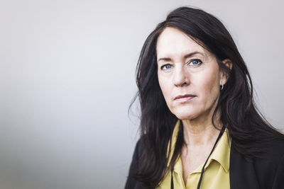 Portrait of female entrepreneur standing in office