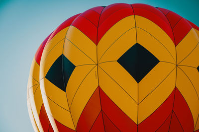 Low angle view of multi colored balloons against sky