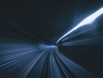 Light trail in illuminated tunnel