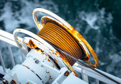 High angle view of rusty cables in boat on sea