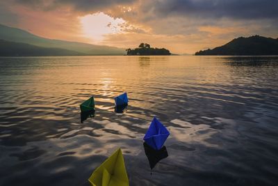 Scenic view of lake against sky during sunset