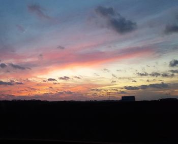 Silhouette of trees against sky during sunset