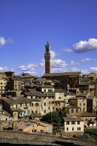 Panoramic view of siena with tiled rooftops, duomo and torre del mangia - tuscany, italy