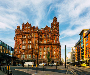 View of buildings against cloudy sky