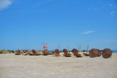 Scenic view of beach against clear blue sky