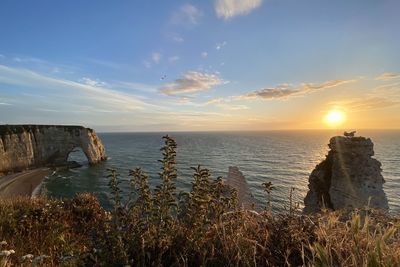 Scenic view of sea against sky during sunset