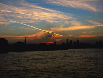 Scenic view of river at sunset