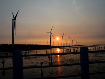 Silhouette of pier at sunset