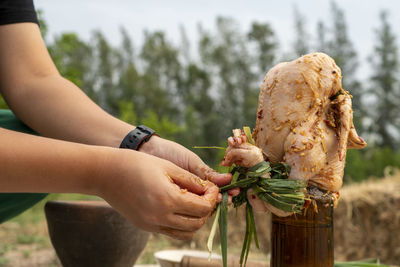 Midsection of woman holding ice cream